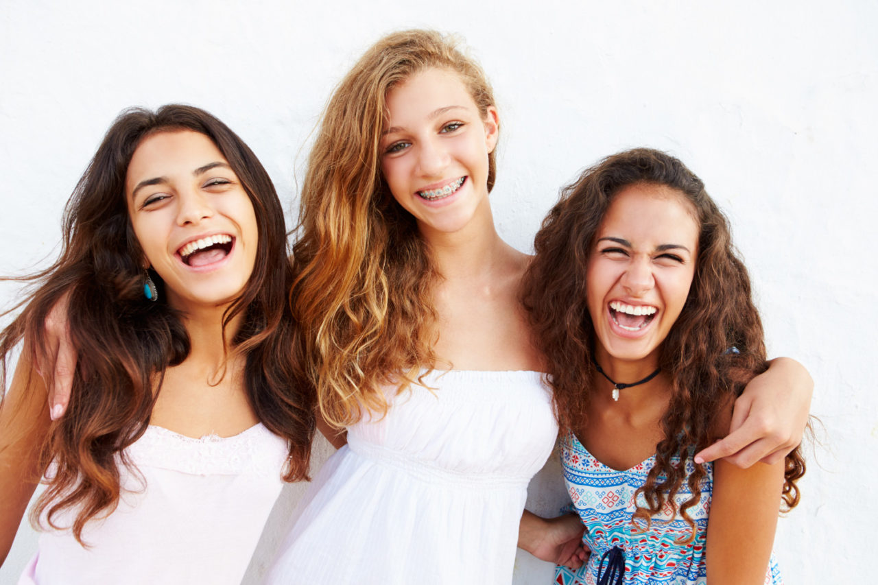 teens smiling with braces