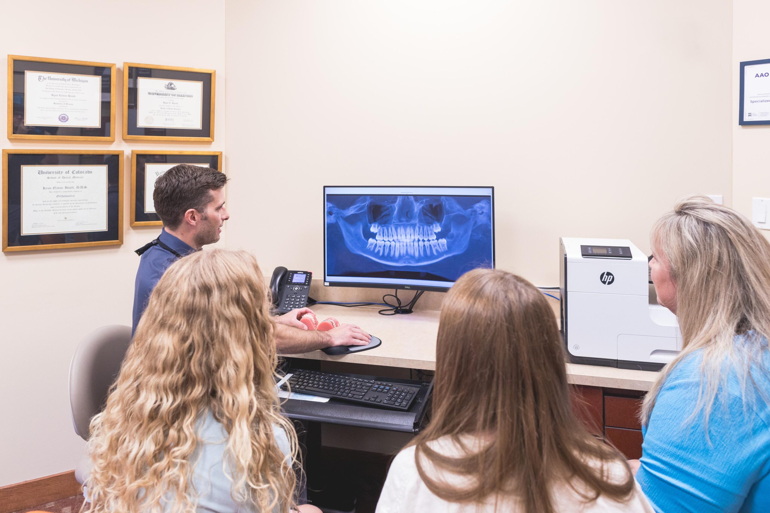 A family consulting with their trusted Orland Park Orthodontist.