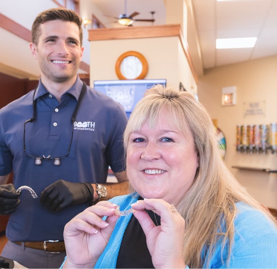 Adult patient and Dr. Booth smiling