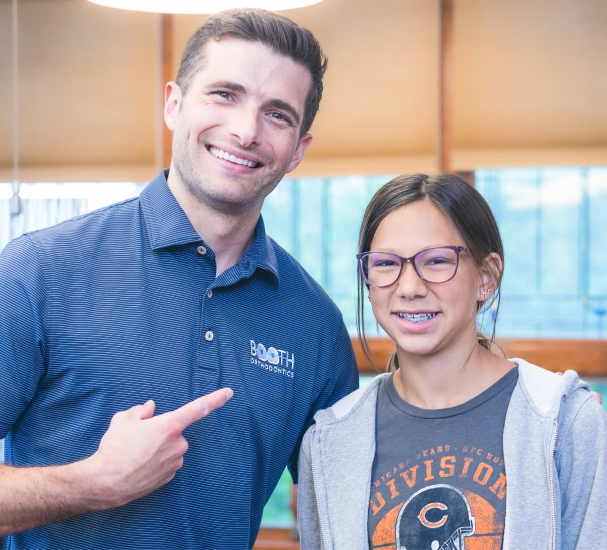 Dr. Booth and teen patient smiling