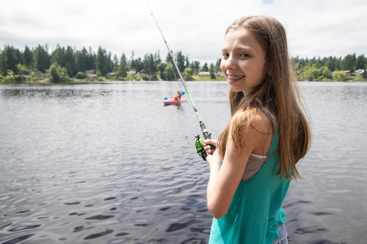 girl with braces fishing