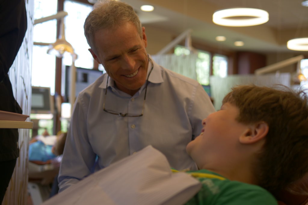 Dr. Booth talking to a patient